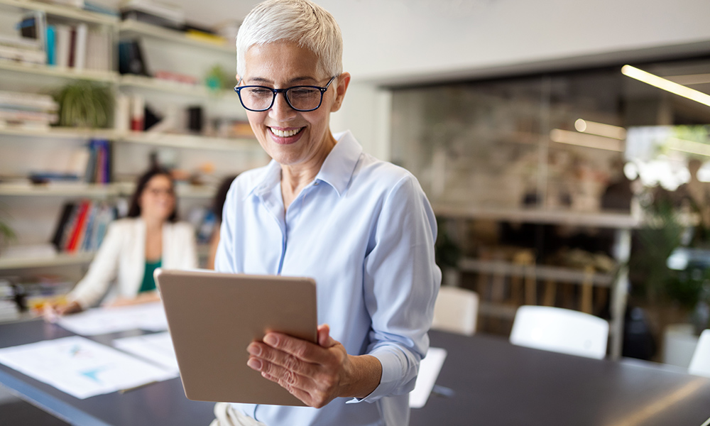 Business Owner looking at tablet.